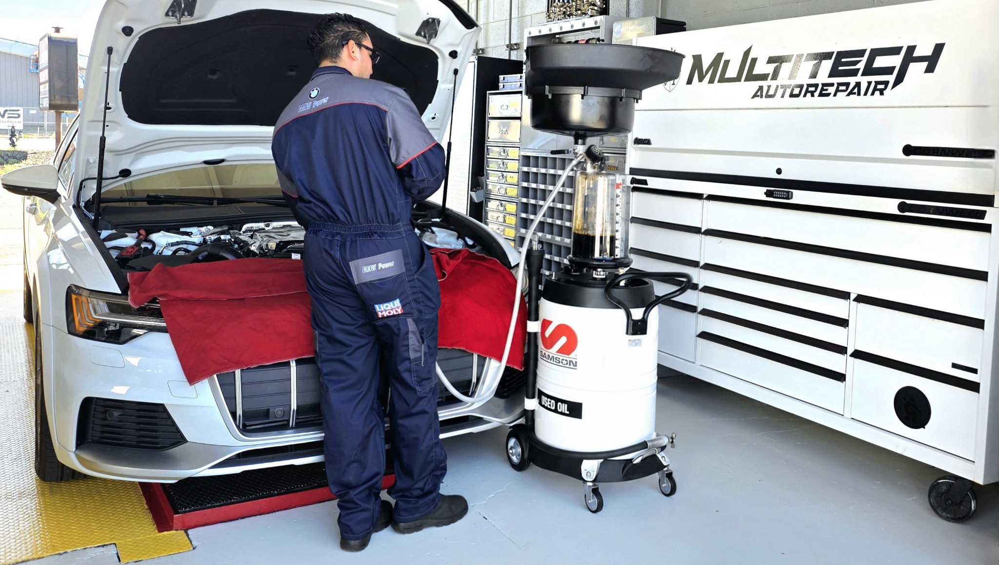 Multi Tech Auto technician servicing a vehicle