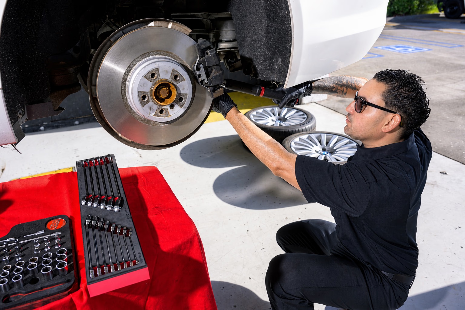 Technician completing brake service at Multi Tech Auto